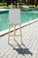 White empty easel at the pool