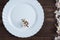 White empty plate with a branch of flowering almond