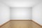 White empty room with brown hardwood parquet floor