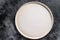 White empty round plate, restaurant background. Black background. Top view. Copy space