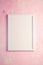 White empty template picture frame on textured bright, pink and peach background, top view