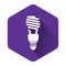 White Energy saving light bulb icon isolated with long shadow. Purple hexagon button