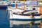 White expensive yachts on the background and old wooden boats. Yacht parking in Cannes, France. Mediterranean Sea. Close-up