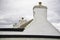 A white facade and an house roof at John o` Groats