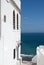 White facade wall and yellow and blue ocean in Tangier,Morocco