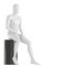 A white faceless mannequin guy sits on a black round stool. 3d rendering