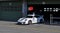 White fast sports car Porsche 911 stands in the garage during a show on the circuit in Brno and is preparing for the races.