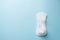 White feather and daily, menstrual woman pad for hygiene or blood period on blue background. copy space . Woman critical days,