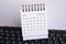 White February 2021 calendar on a keyboard with white backgrounds. New Year Concept