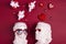 White female and male plaster heads with heart shaped glasses, hearts and gifts overhead on red background