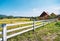 White fence and farm house idyllic rural scenery landscape