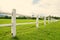 White fence perspective and green grass in Farm (vintage filter style)