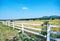 White fence of ranch farmhouse idyllic rural scenery landscape