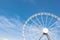 White ferris wheel against blue background