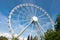 White ferris wheel against blue sky