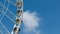 White Ferris wheel cloud and blue sky