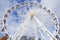 White ferris wheel with cloudy blue sky taken at Darling Harbour in Sydney Australia on 6 July 2016