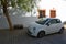 White Fiat 500 Motor Car parked in spainish Village Street.