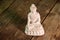 white figurine of the buddha of the fossil