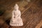 white figurine of the buddha of the fossil