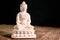 white figurine of the buddha of the fossil