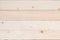 White Finland pine wood woodgrain texture background in natural beige brown color