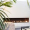 White fireplace modern design with green plant