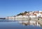 White fishing village castle river water reflections, Alentejo, Portugal