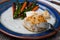 White flakey sea bass with breadcrumbs and roasted asparagus and