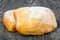 White flat ciabatta bread on sourdough on a wooden background