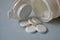 White flat medicine tablets on a blue background