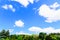 white fluffy clouds on a background of blue sky