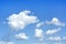 White fluffy clouds and blue sky. Nature weather background