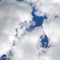 White fluffy clouds in a dark blue sky