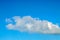 White fluffy cumulus cloud. Blue sky. Close-up