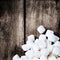 White Fluffy Round Marshmallows on wooden vintage background w