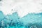 White foam blue water background closeup, sea or ocean foam wave pattern, froth bubbles texture, soap spume backdrop, soap sud