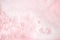 White foam bubbles texture on pink pastel background, copy space, banner for loundry, cleaning service, bathroom concept, clean,