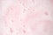 White foam bubbles texture on pink pastel background, copy space, banner for loundry, cleaning service, bathroom concept, clean,