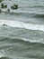 White foamy waves at beach from lake