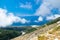 White fog high in mountains on Llogara pass. View from highlands on serpentine road to pass.Landscape of Albanian Riviera