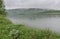 White fog over the  river in summer morning