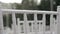 White folding chairs at the wedding ceremony with drops from the rain. Wet seat in the open air