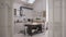 White folding door opening on contemporary kitchen in scandinavian style, interior design, architect designer concept