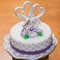 white fondant wedding cake with a heart and dove pigeon topper m