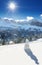 White forest, blue sky, sun and snowman in Swiss Alps during a beautiful sunny day, Klewenalp ski resort