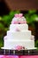 White four tiered wedding cake on table