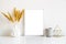 White frame and home decoration details on tabletop with wall, artwork poster mock-up