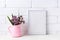 White frame mockup with purple flowers in pink rustic pitcher