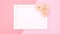 White frame for text appear from the top with flowers on pink theme. Stop motion